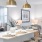 Gold pendant lights over a white kitchen island