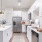 White cabinet kitchen with stainless appliances