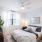 Large bedroom with bright windows and carpet flooring