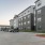 Open surface parking lot outside apartment building